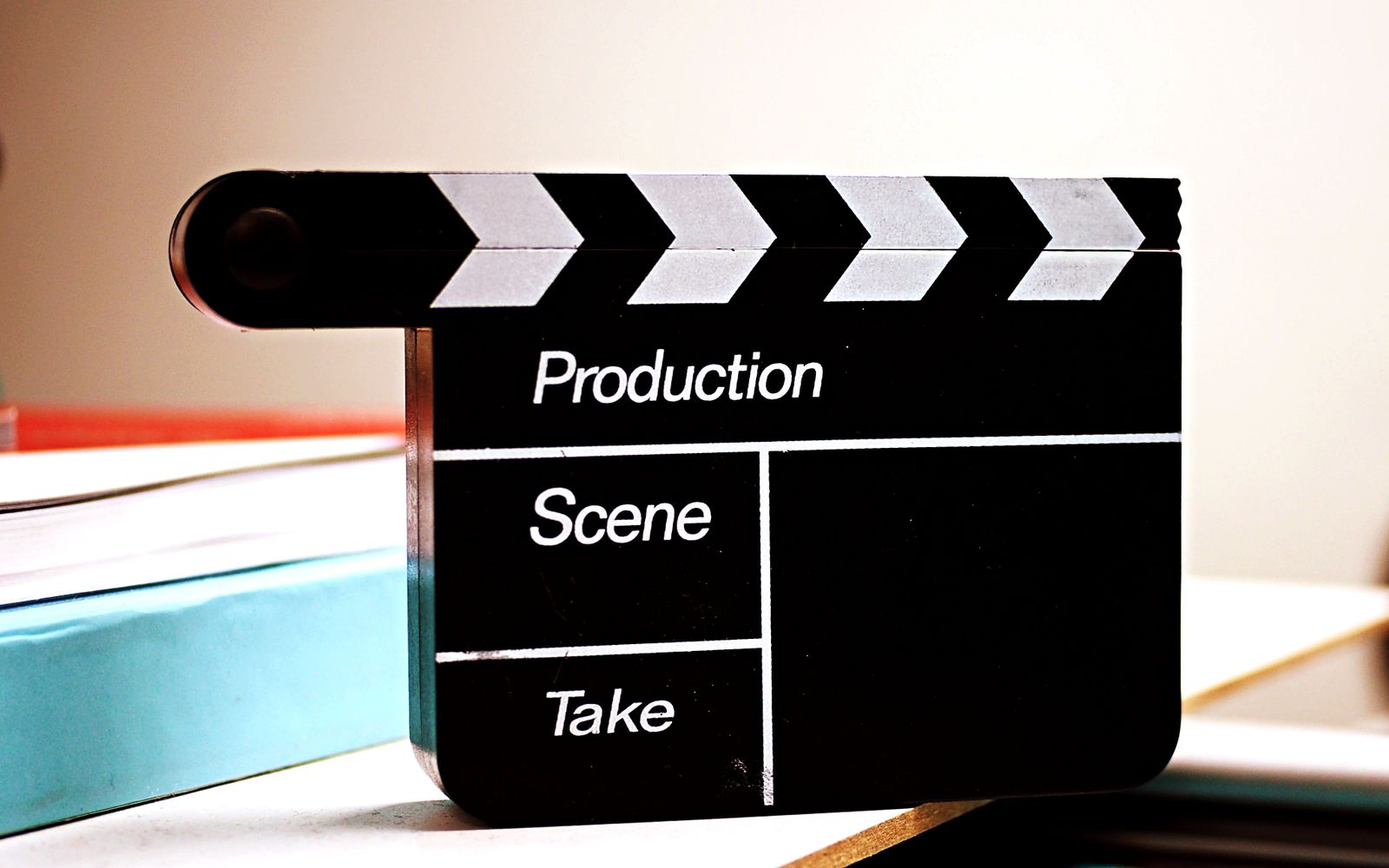 A black-and-white close-up of a film clapperboard, ready for a take.
