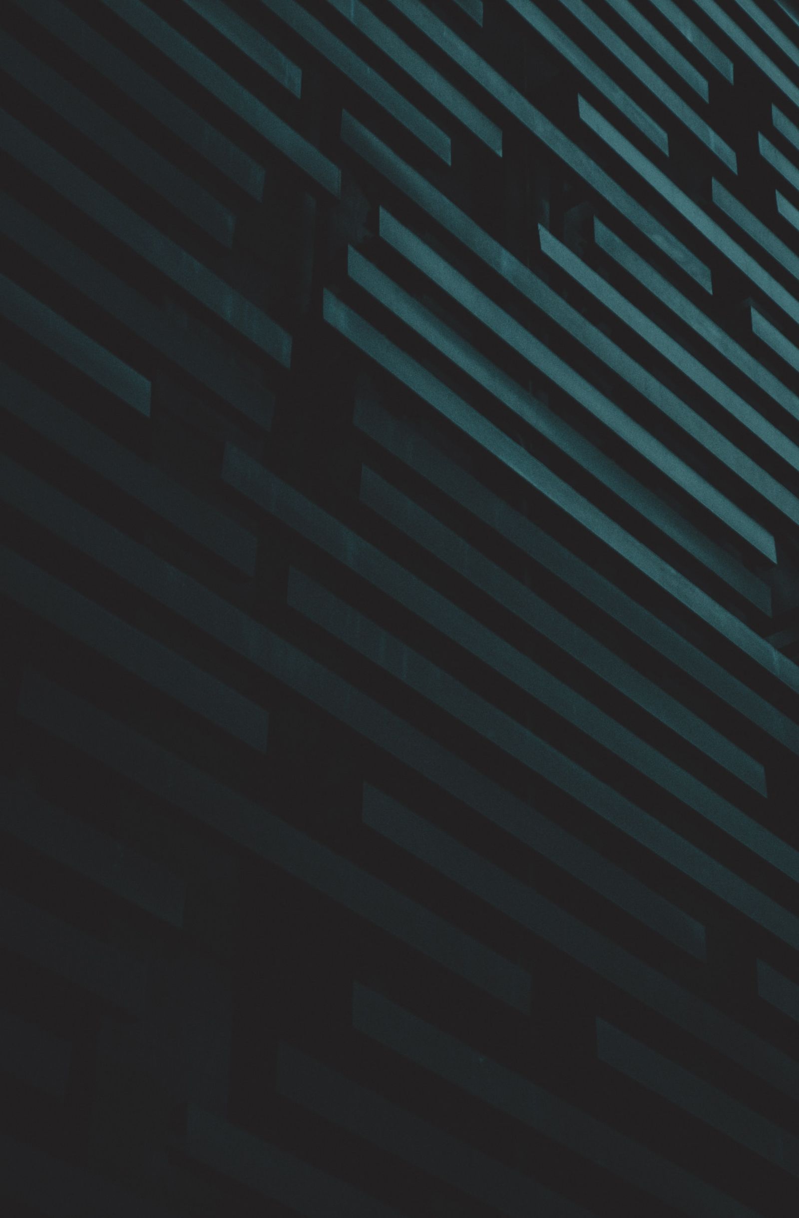 Geometric architectural detail of a modern building, rendered as light and shadow.